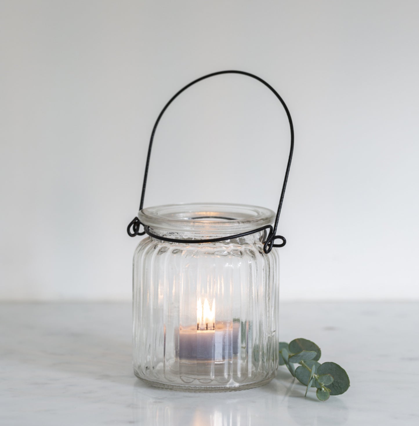 Glass ribbed tea light holder